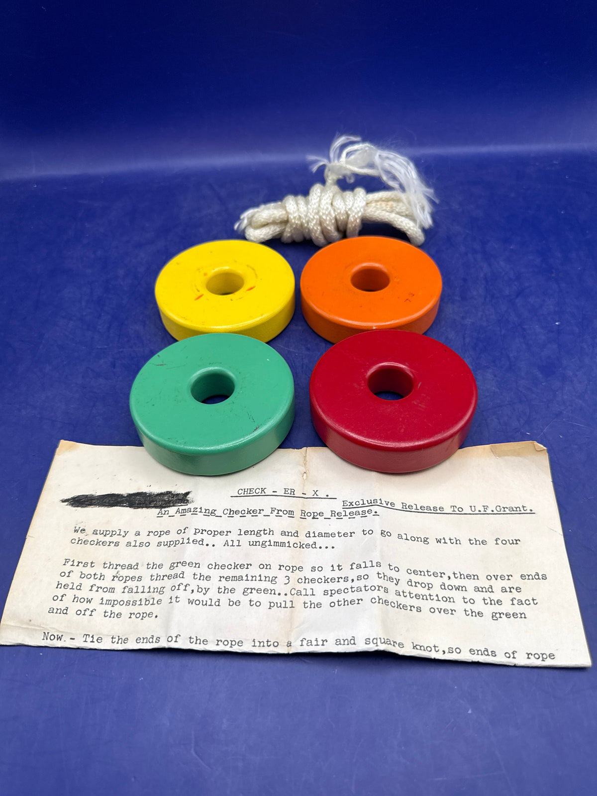 Check-Er-X by U.F. Grant – Vintage Wooden Block & Rope Penetration